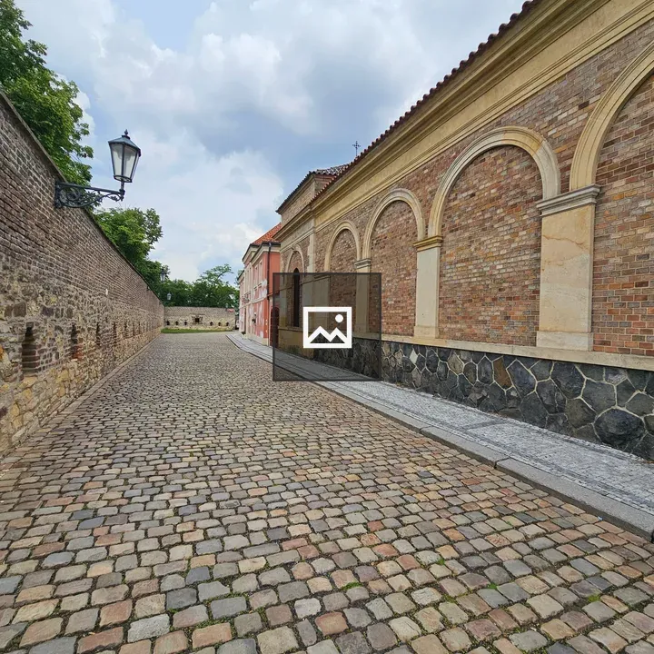 Cobblestone Path to Brick Building
