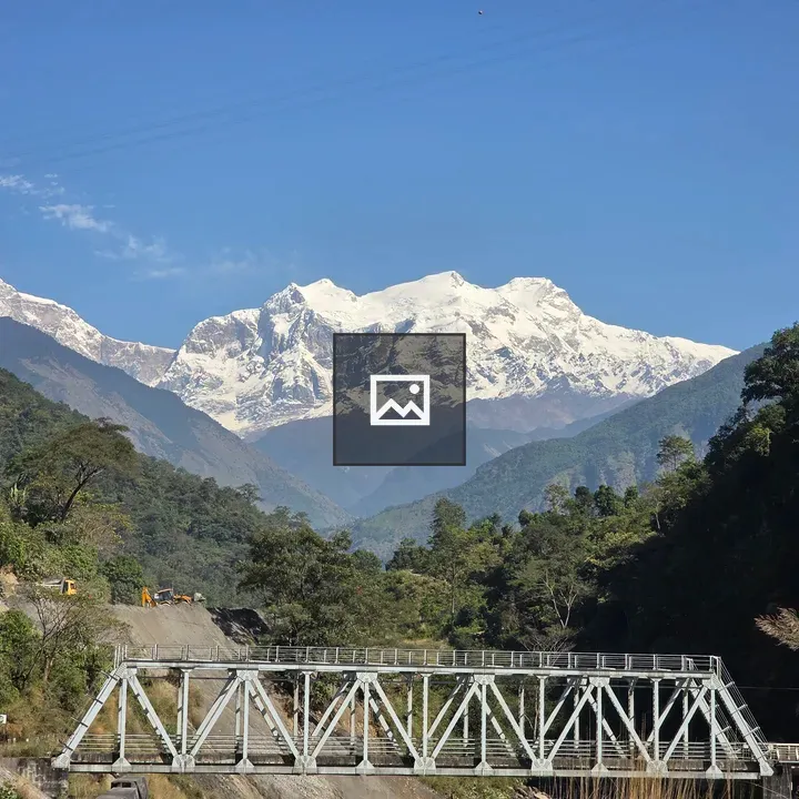 Snowy Mountain View with Bridge