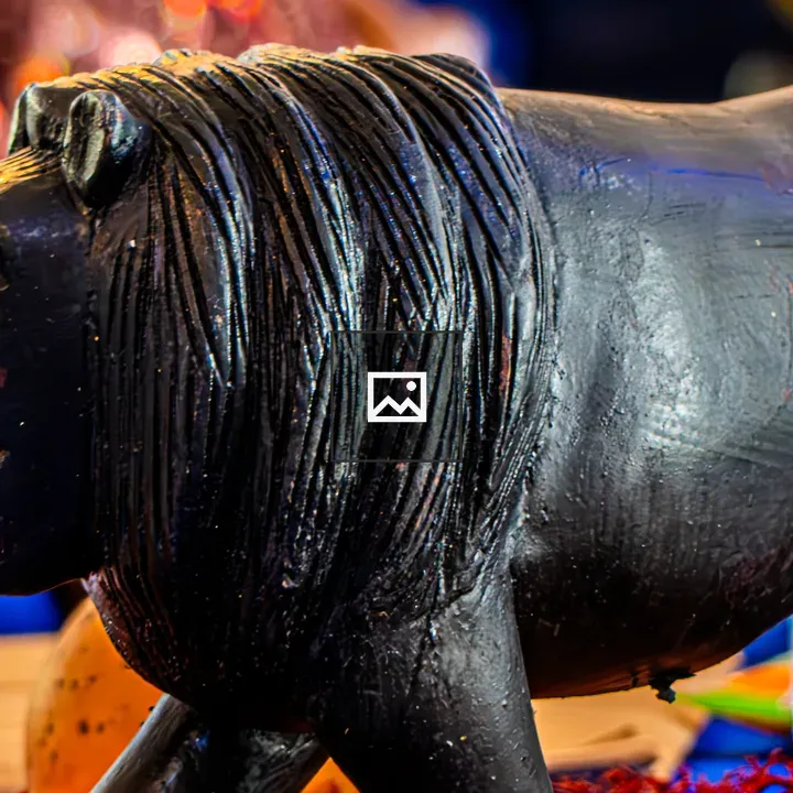 Side-view Lion Wood Sculpture