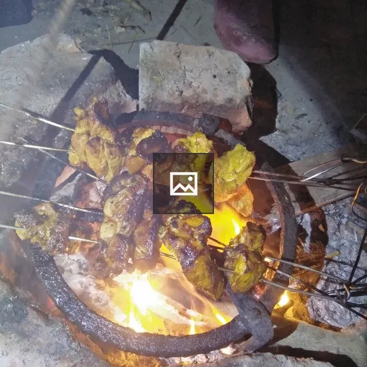 Meat on skewers over a brazier
