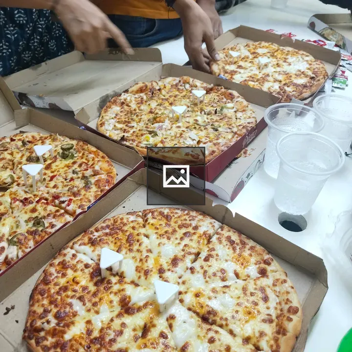 Pizza Boxes and Slices on Table