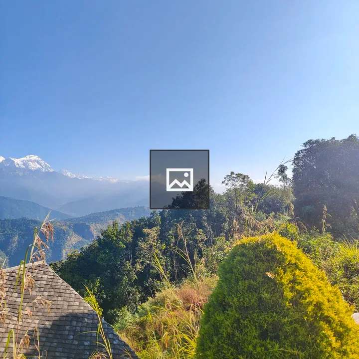 Mountainous Terrain Under Clear Sky