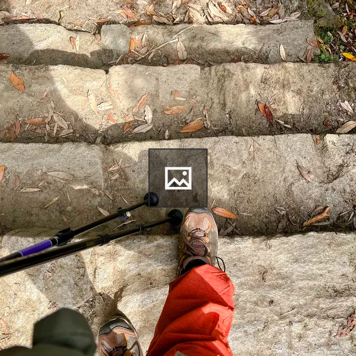Feet in hiking boots on steps