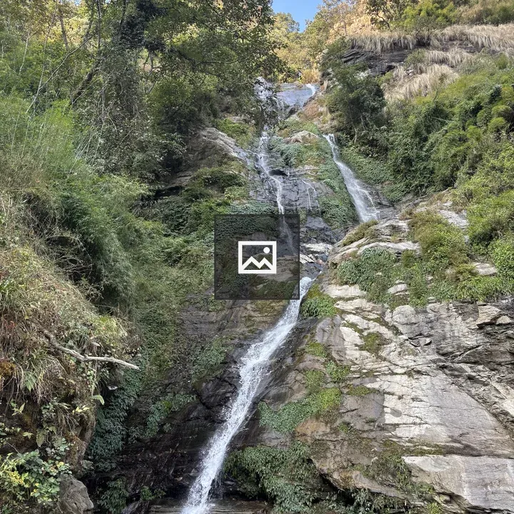 Cascading waterfall on rocky cliff