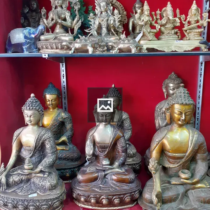 Buddha statues on shelves