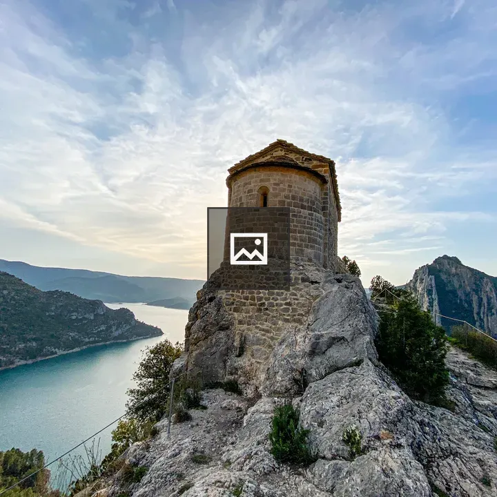 Stone building on rocky cliff