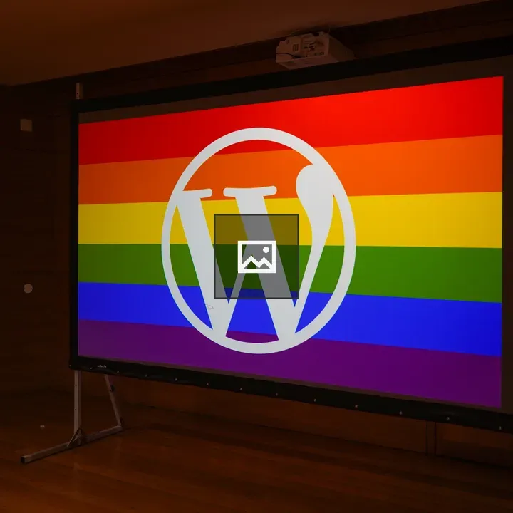 WordPress logo on rainbow screen