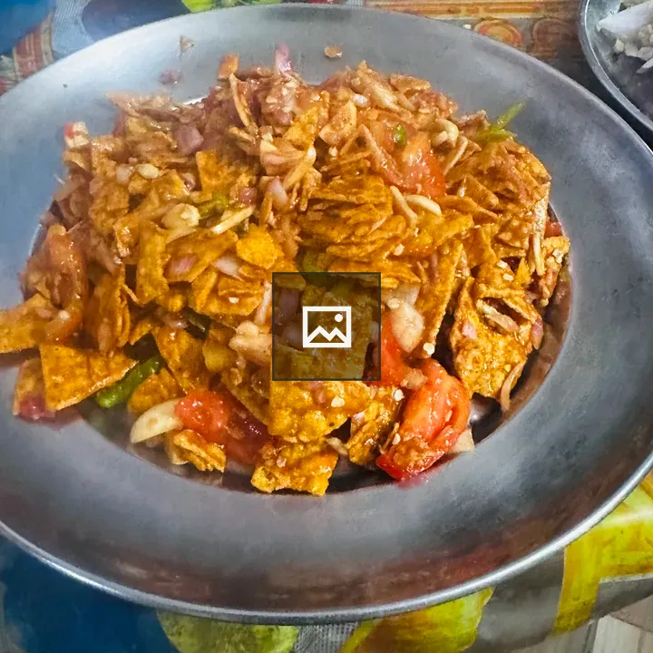 Rimmed silver dish with food