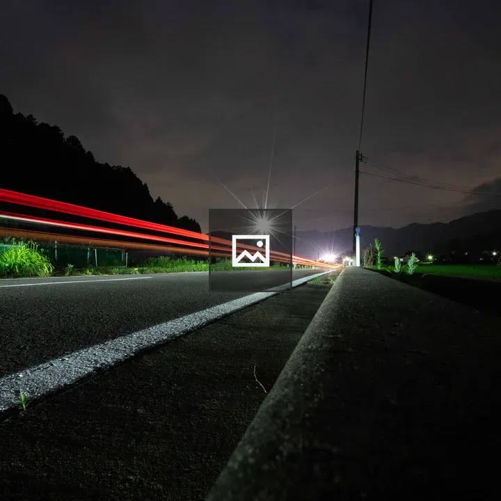 Red light trail on night road