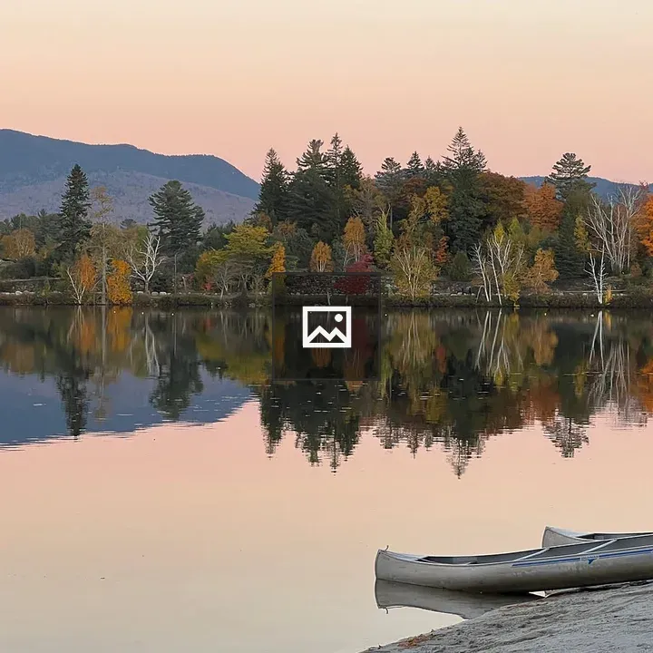Lake at Sunset with Forest and Canoes