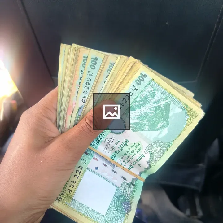 Close-up of Nepal currency hand stack