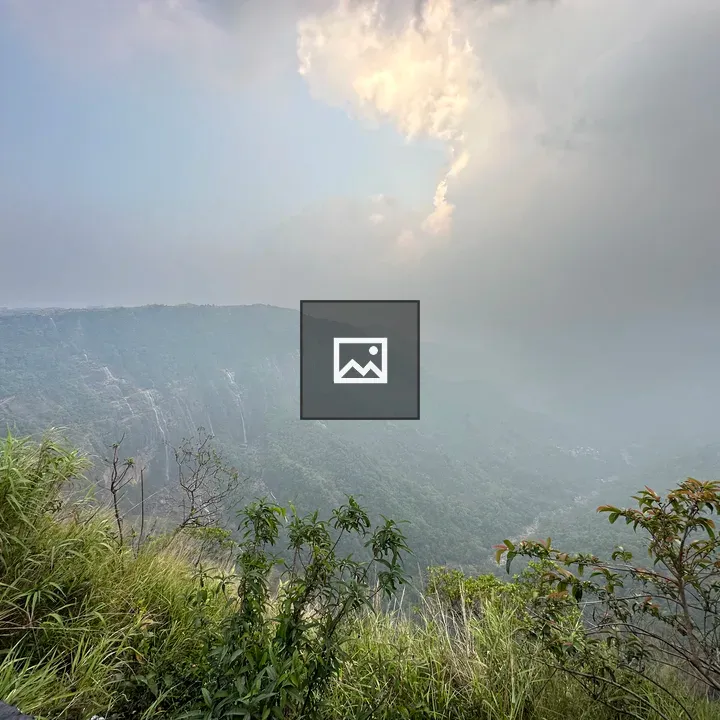 Mountain range in mist with sunlight