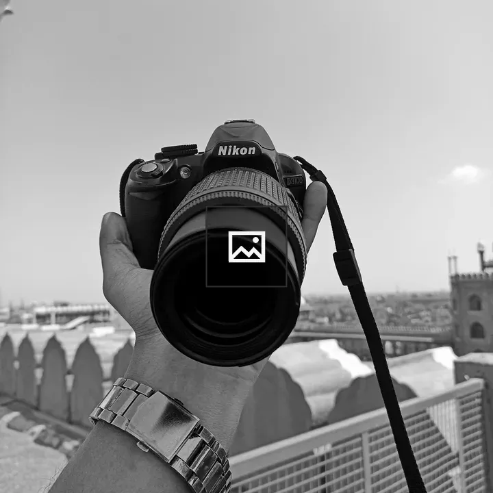 Nikon camera in hand
