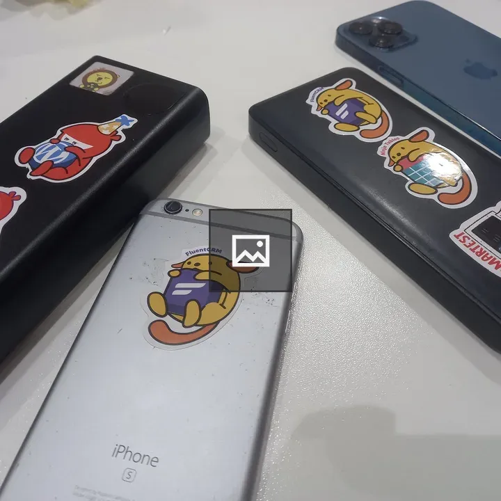 Two iPhones and Batteries with Wapuu