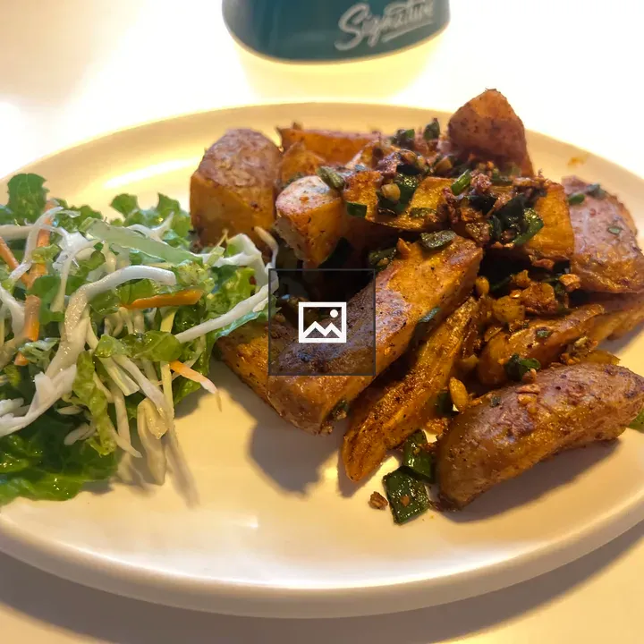 Plate of fried potato wedges