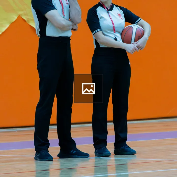 Two basketball referees side by side