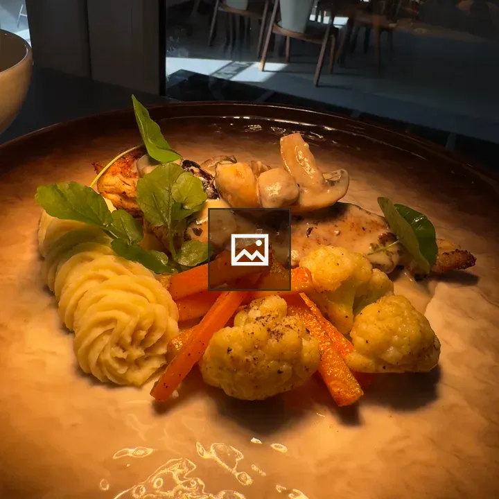 Plated dish with mashed potatoes and meat