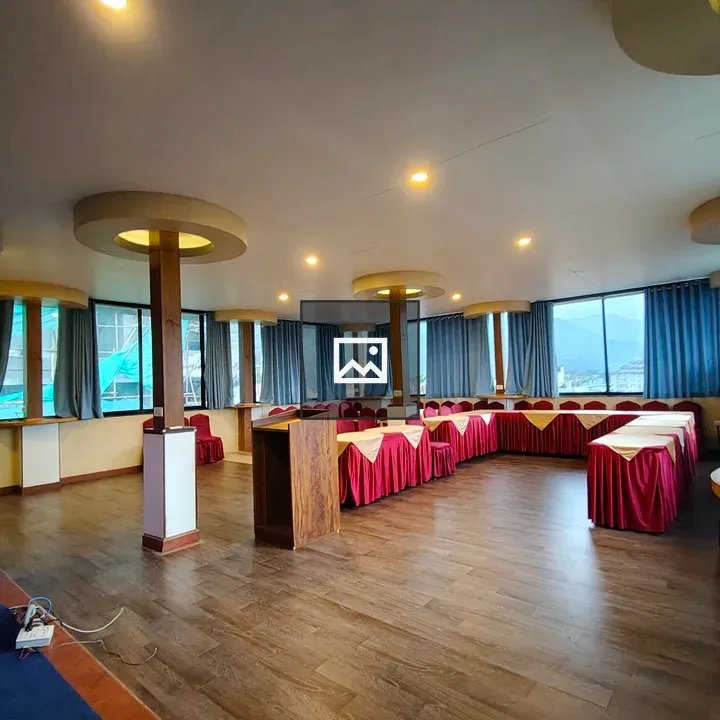 Room with wooden flooring and windows