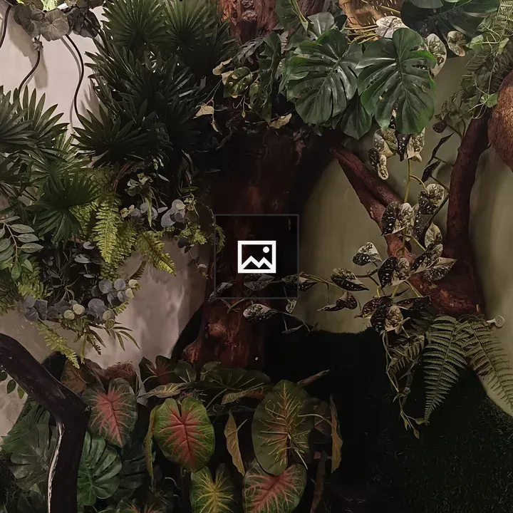 Artificial plants with lights in room corner