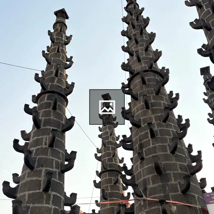 Tall stone towers against sky