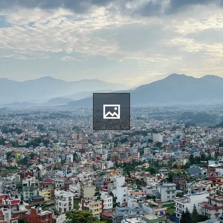 Panoramic Cityscape with Mountains