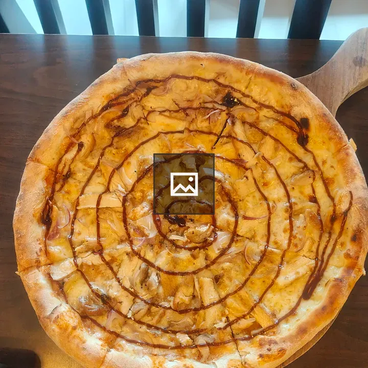 Pizza on Wooden Paddle