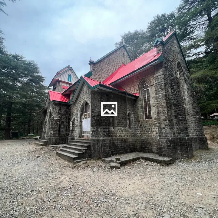 Historic stone church with red roofs