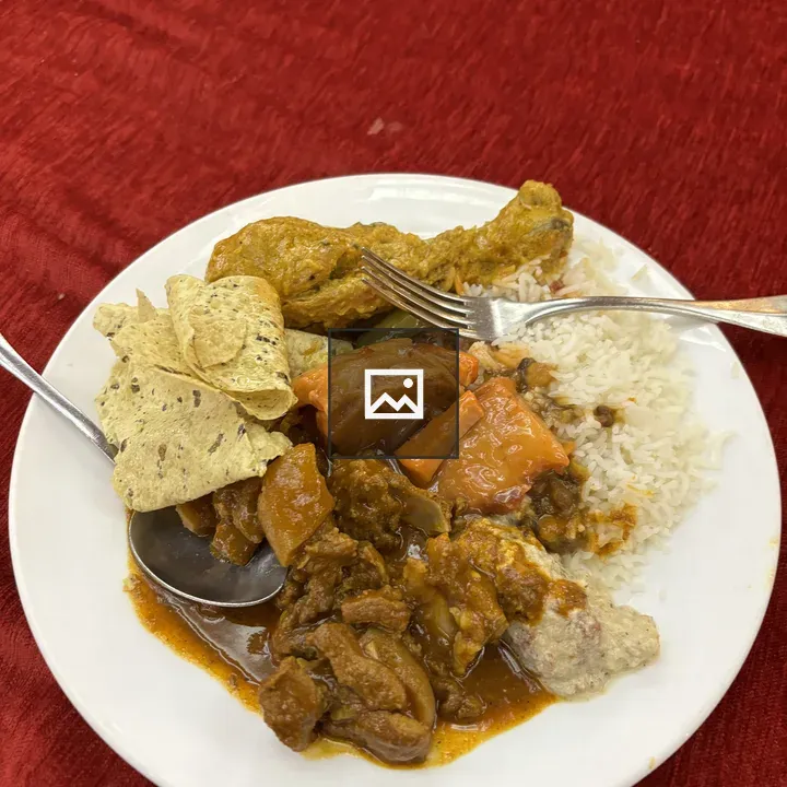 Plate with yellow marinated mutton and rice