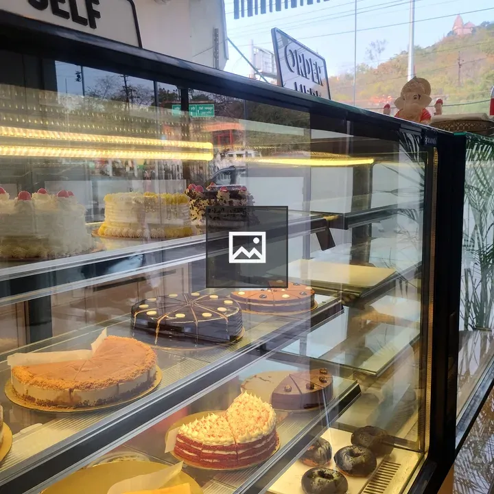Bakery Display with Cakes and Pastries