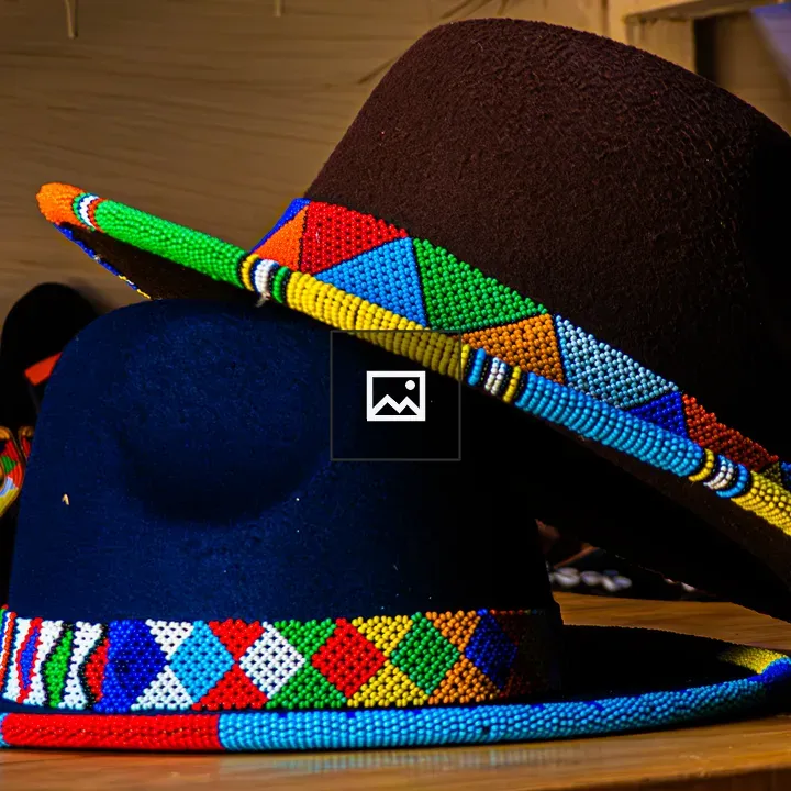 Two felt fedora hats on wood