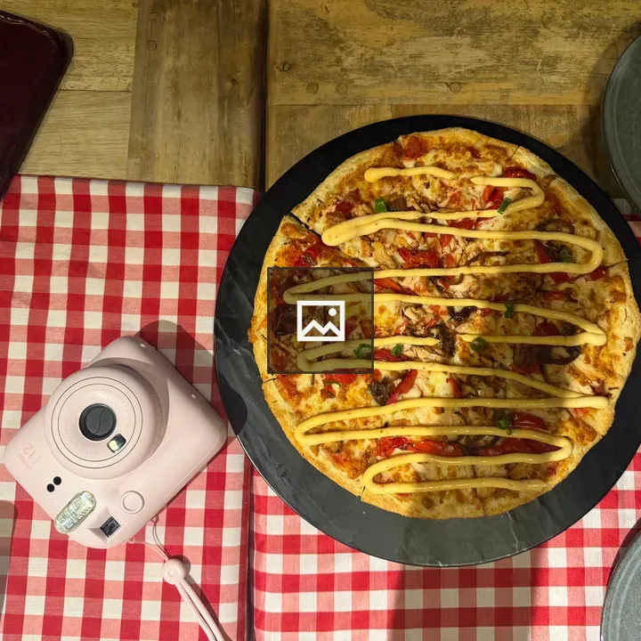 Pizza on a checkered tablecloth