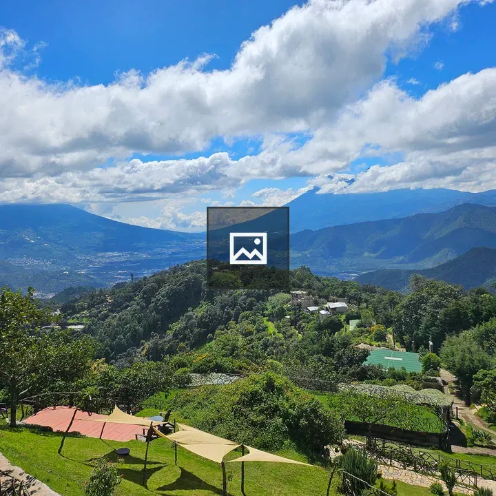 Mountain landscape with valley and blue sky