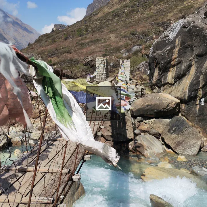 Mountain suspension bridge with flags