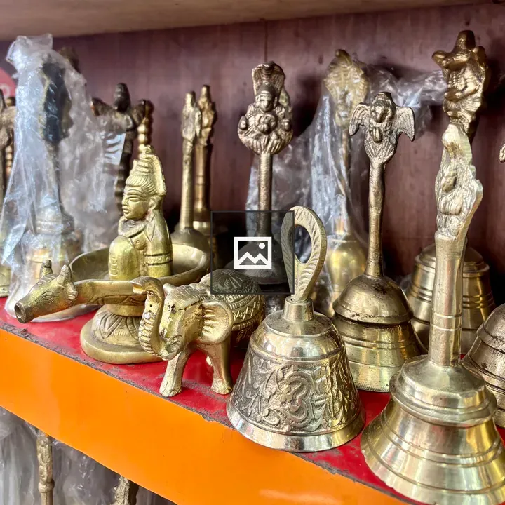 Brass artifacts on shelf