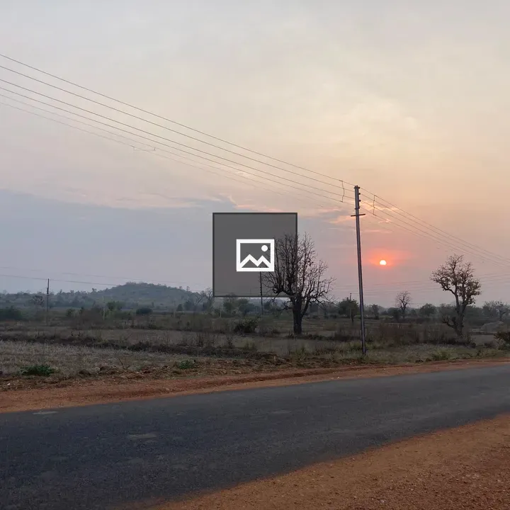 Sunset in a village field