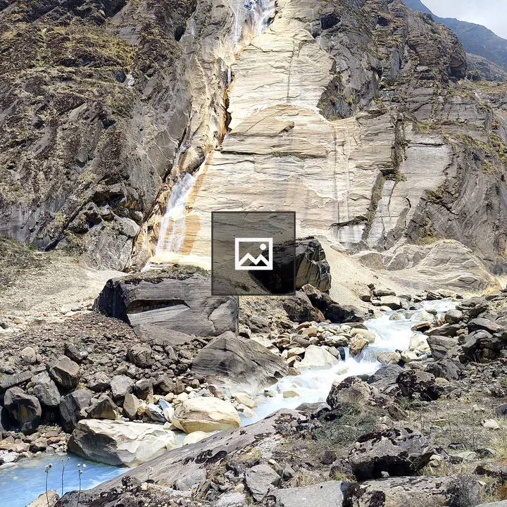 Rocky cliff with waterfall