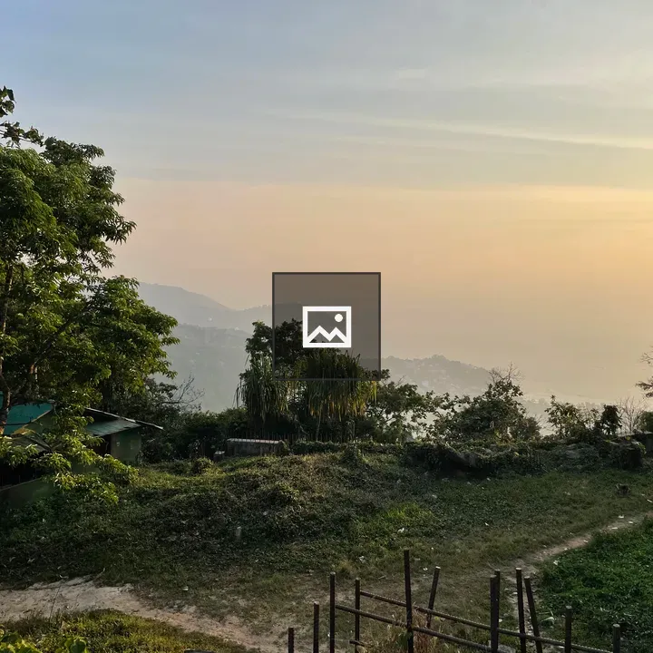 Sunset over misty hills and sea