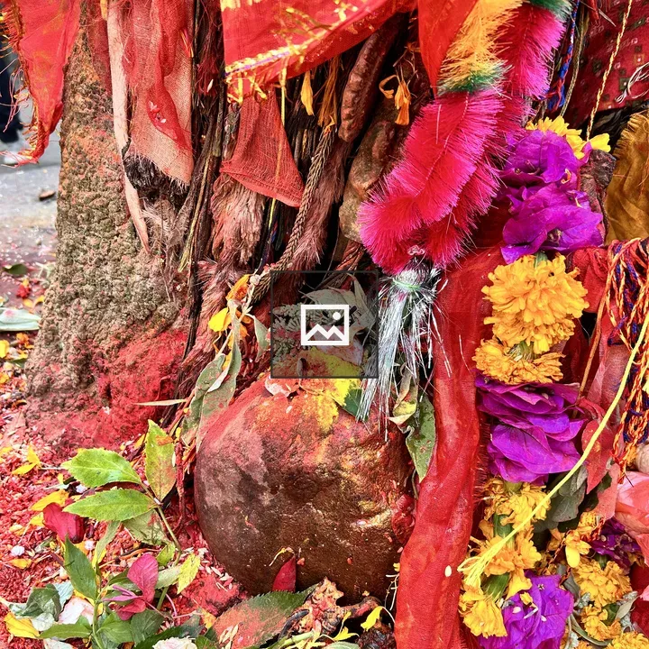 People pray to a stone