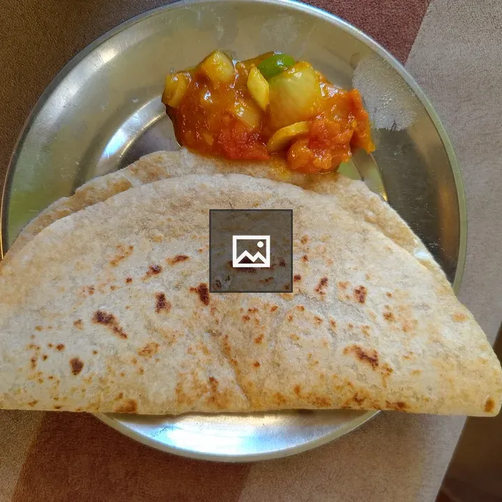 Golden flatbread on steel plate