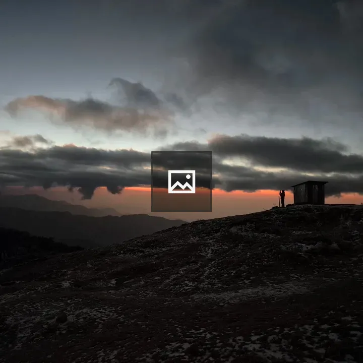 Silhouette on a hilltop at dusk