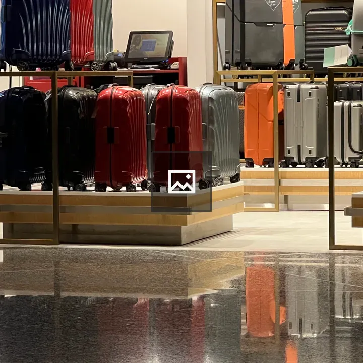 Suitcases at Airport Corner