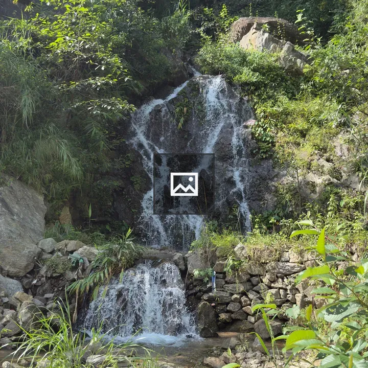 Waterfall Over Rocks in Green