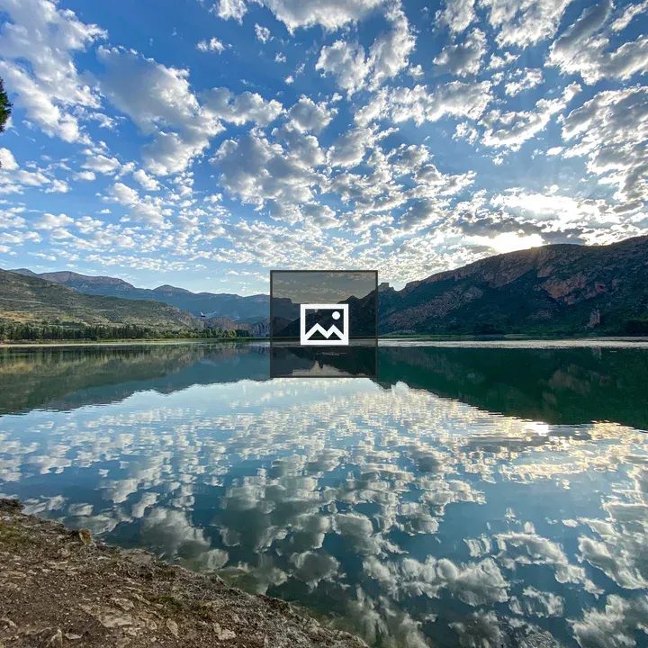 Lakeside Reflection with Clouds