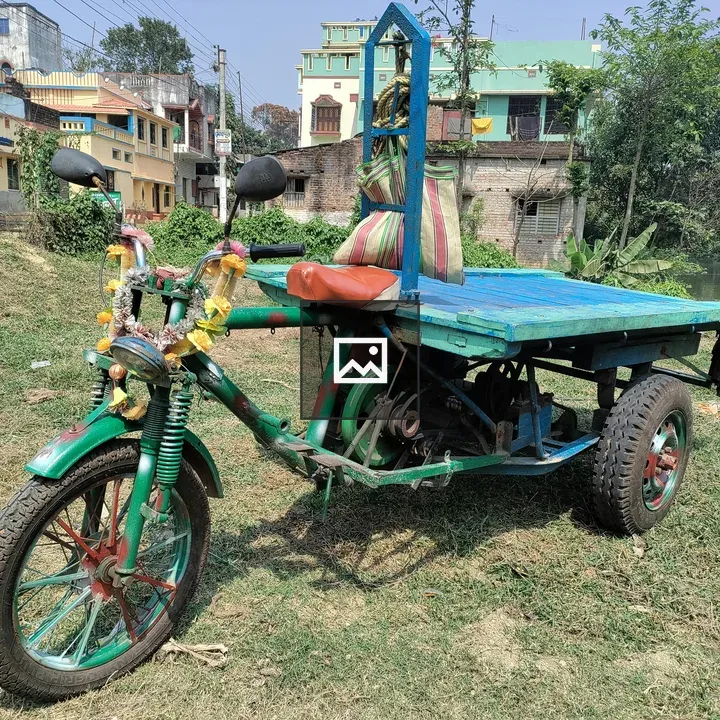 Three wheeled scooter with flatbed