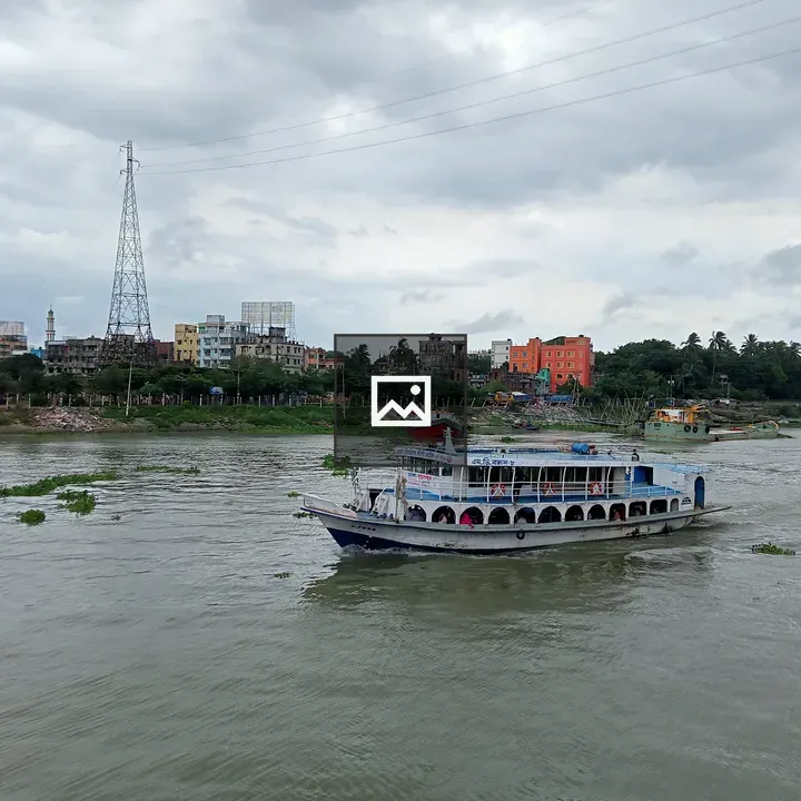 River scene with white and blue passenger boat