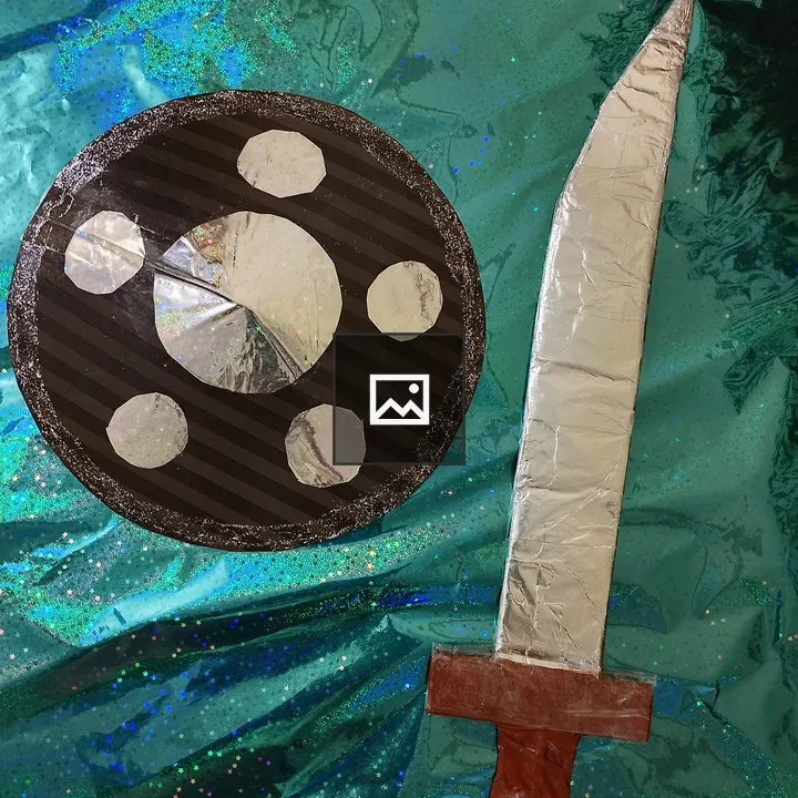 Toy Sword and Shield on Sparkly Paper