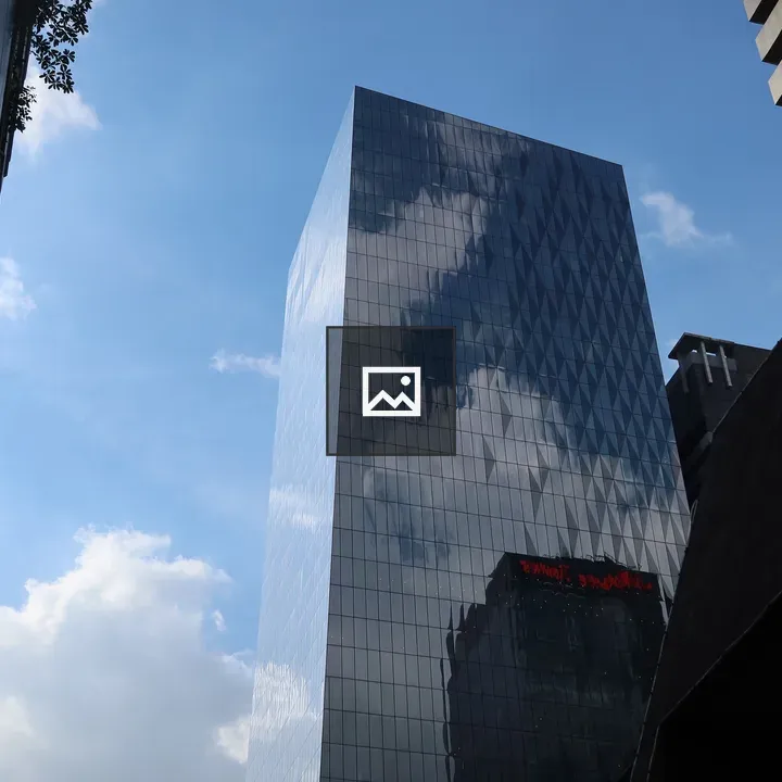 Glass Building Against Sky