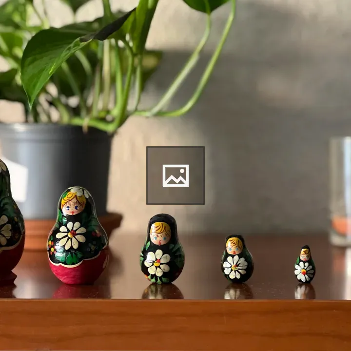 Matryoshka dolls on wood table