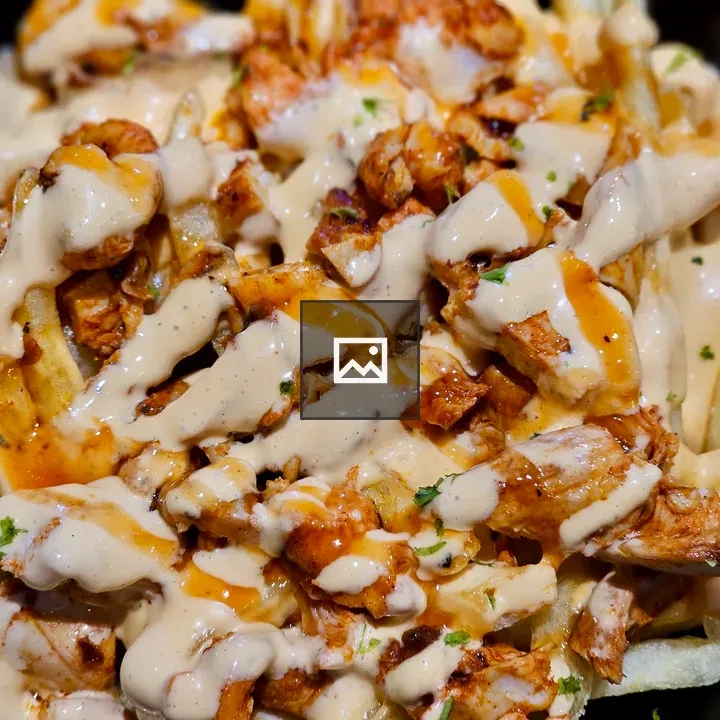 Loaded bowl of fries with chicken