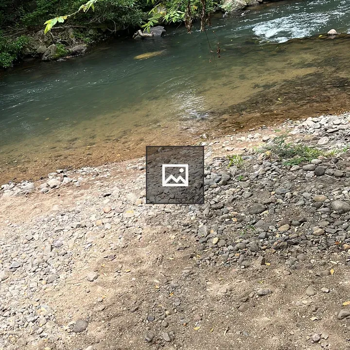River scene with pebbly bank